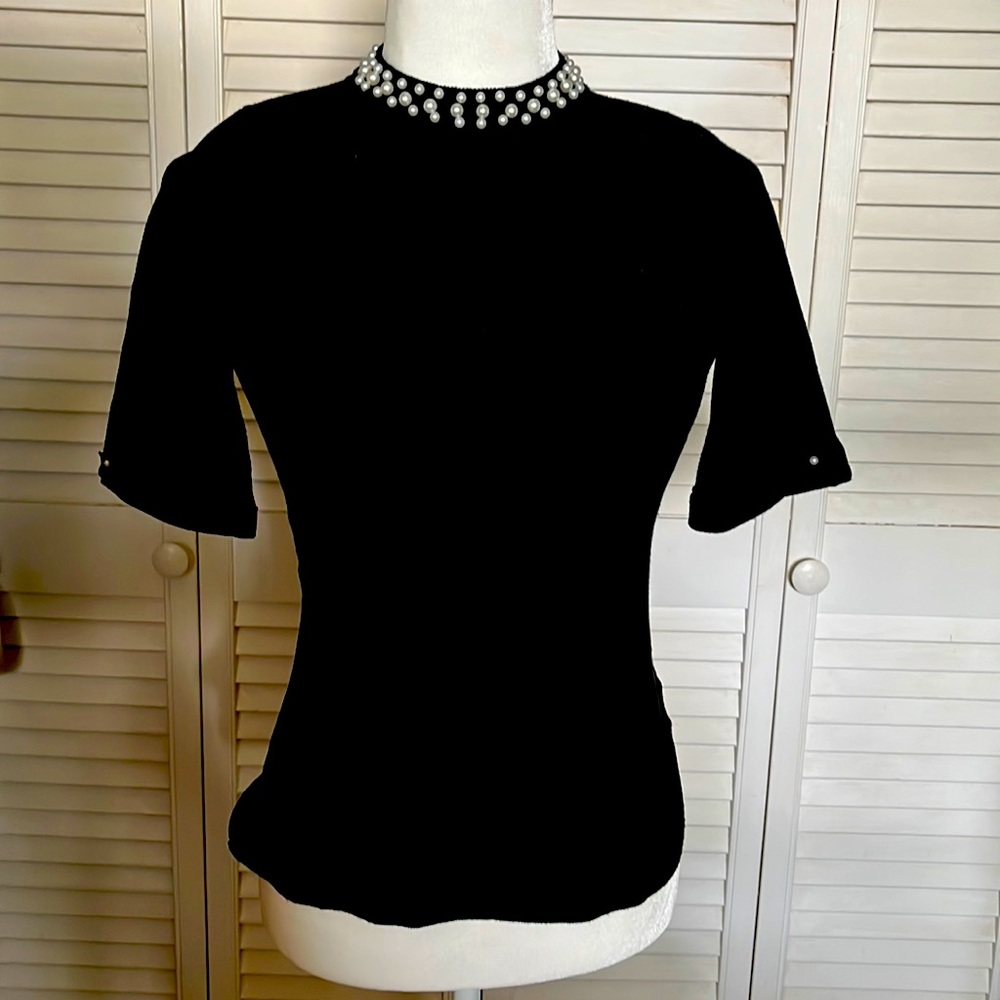 Black short sleeved Top with  Pearl detail around neck and sleeve-